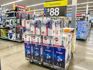 Hoover Total Home Pet Max Vacuum Cleaners on display at Walmart. Yellow clearance sign above display says $88.