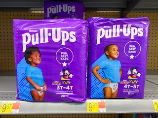 Huggies Pull-Ups products on shelf at Walmart. Price tag on shelf indicates that the price is $9.97.