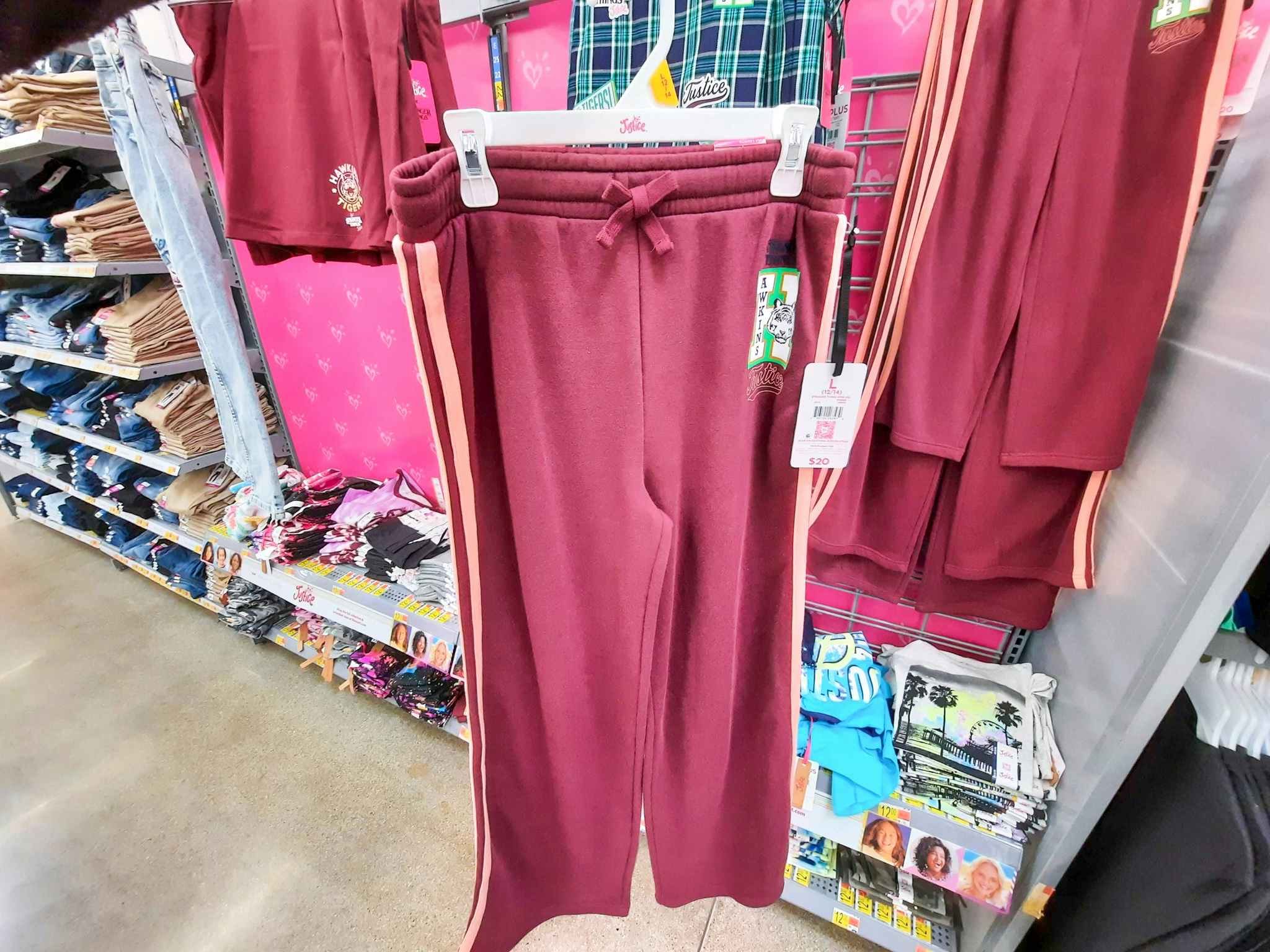 hand holding justice stranger things sweatpants at walmart