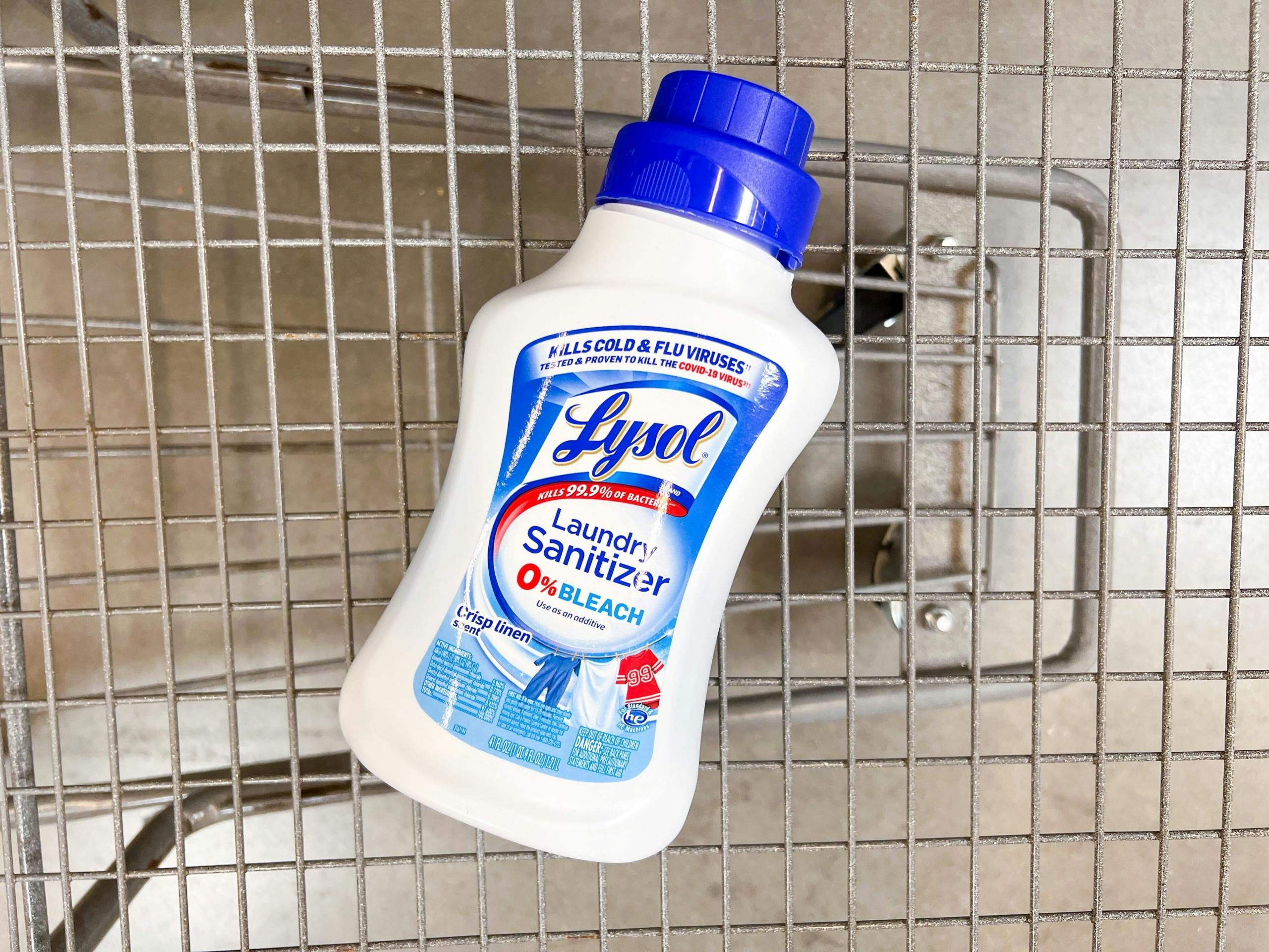 Lysol laundry sanitizer laying down in a Walmart cart