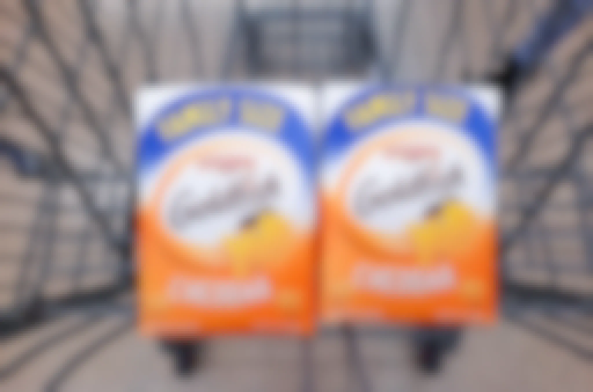 Two 10-ounce packages of cheddar flavored Goldfish in Walmart shopping cart
