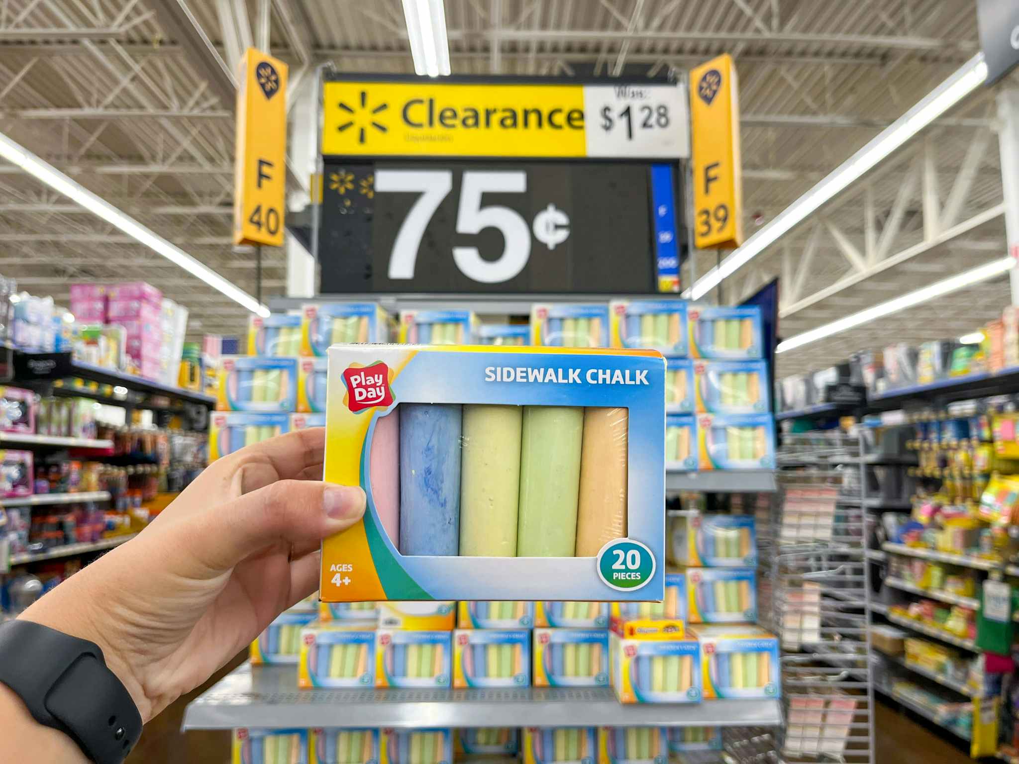 hand holding play day sidewalk chalk at walmart