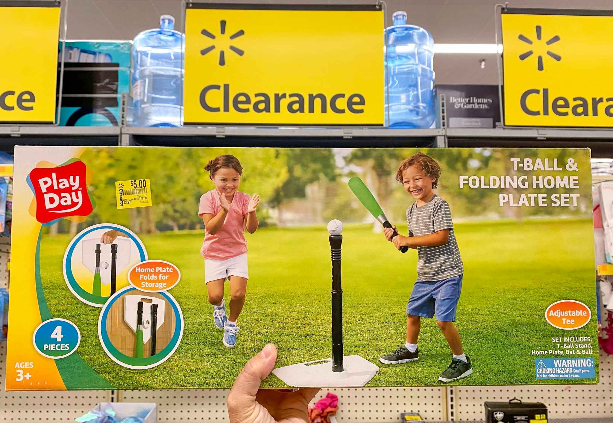 hand holding play day t-ball set in walmart clearance aisle