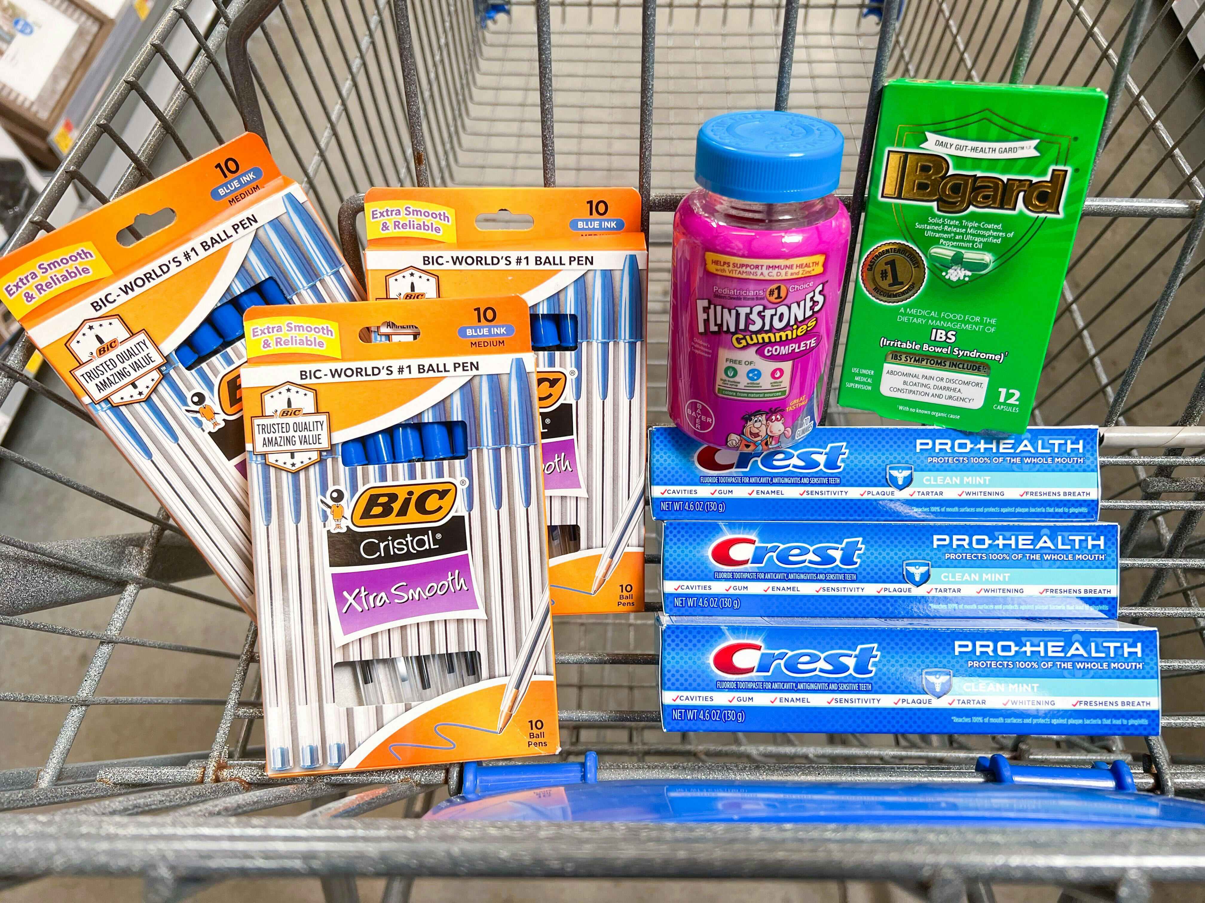 Crest, Flinstones Vitamins, IBguard, and BIC products in Walmart shopping cart
