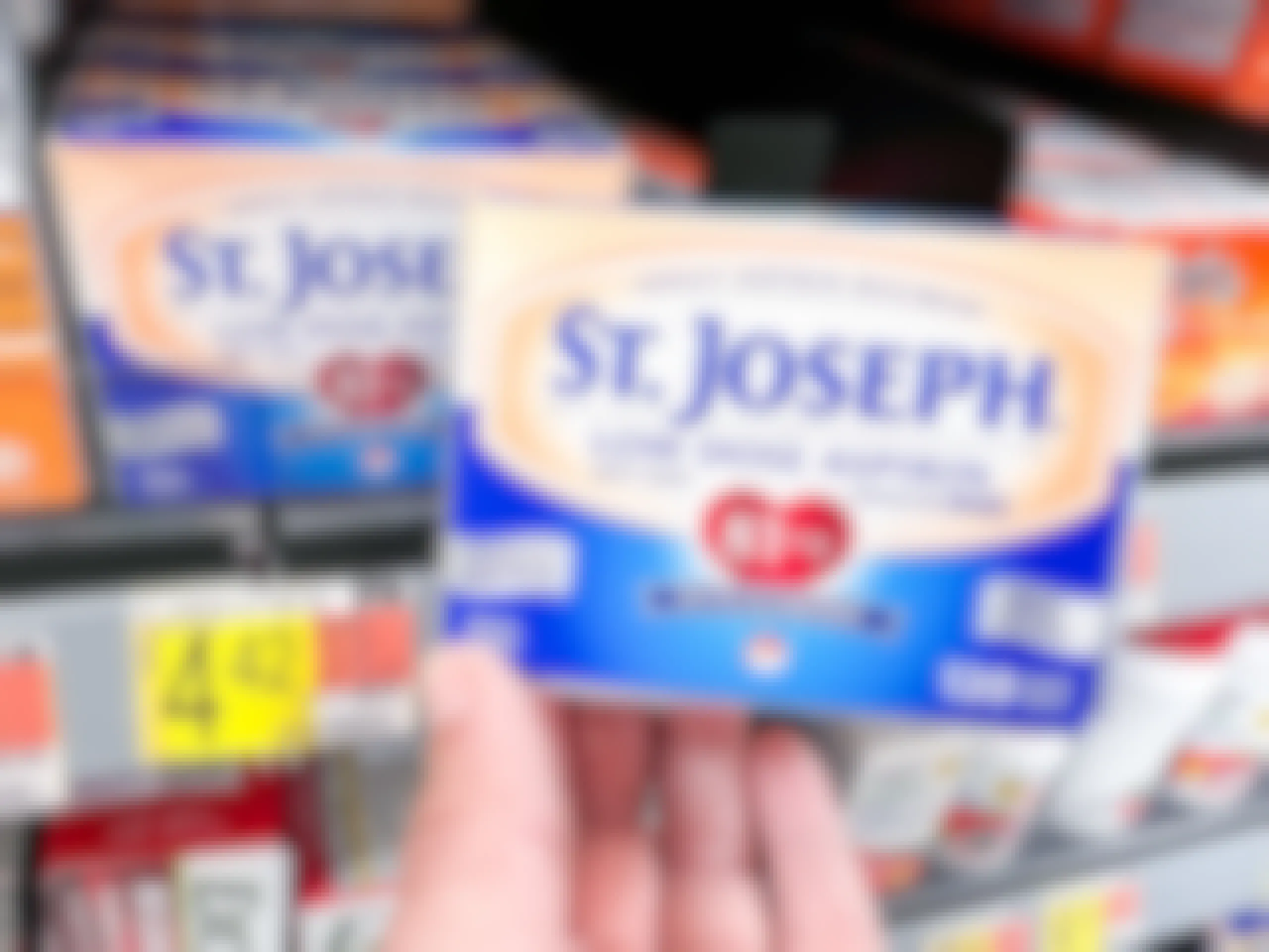 St. Joseph Low Dose Aspirin held in front of shelf at Walmart. Price tag reads $4.42.