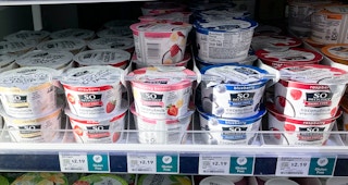 yogurts on shelf with sales sign at whole foods