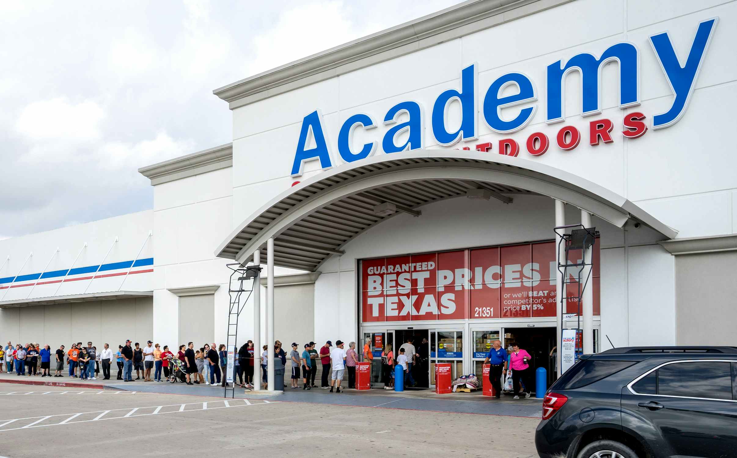 Academy Sports + Outdoors storefront with line