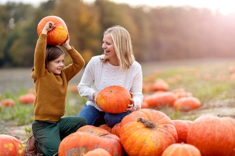 mother and child at pumpkin patch