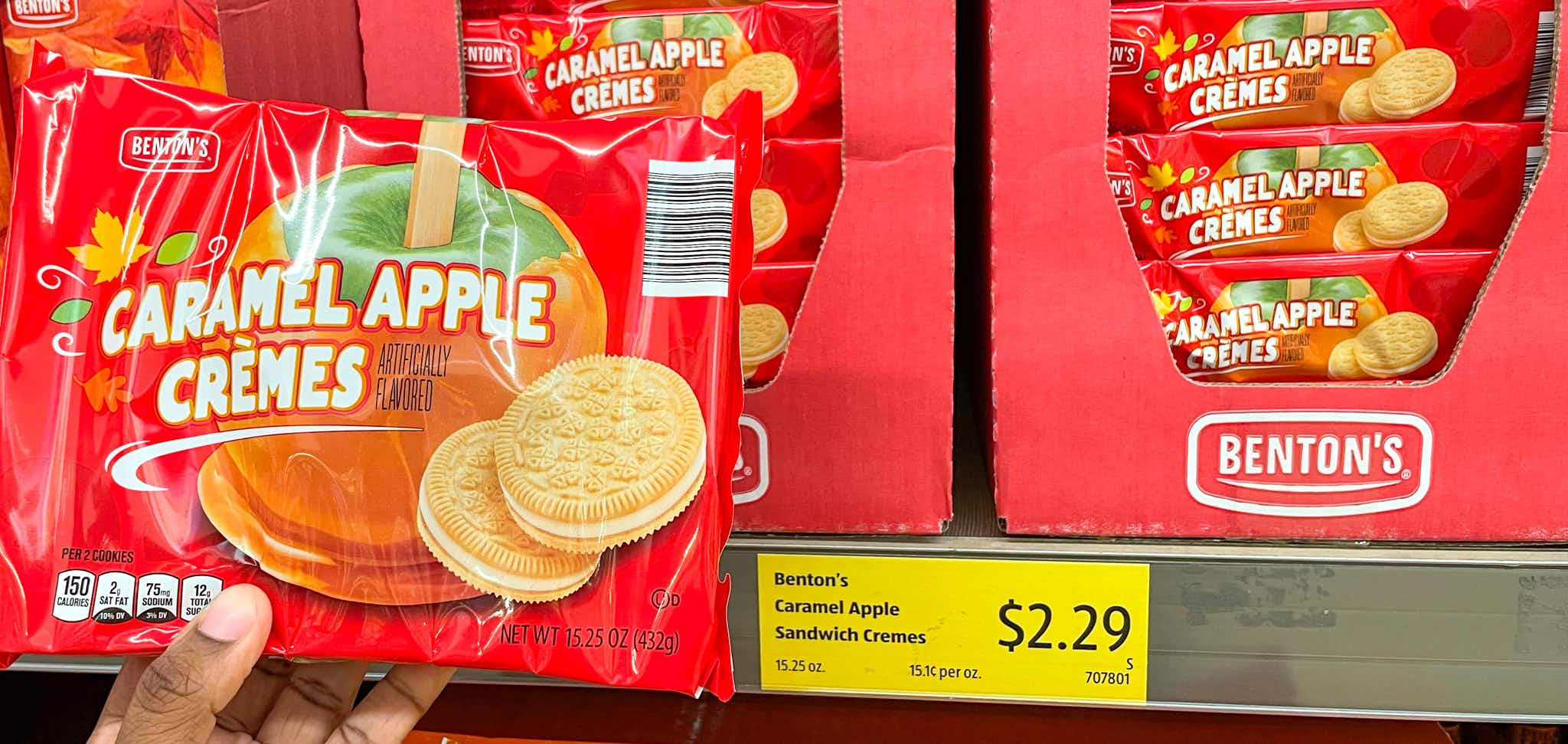 cookies hand held near sale sign at aldi