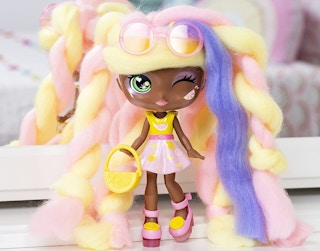 A Lacey Lemonade doll in front of a mirror.