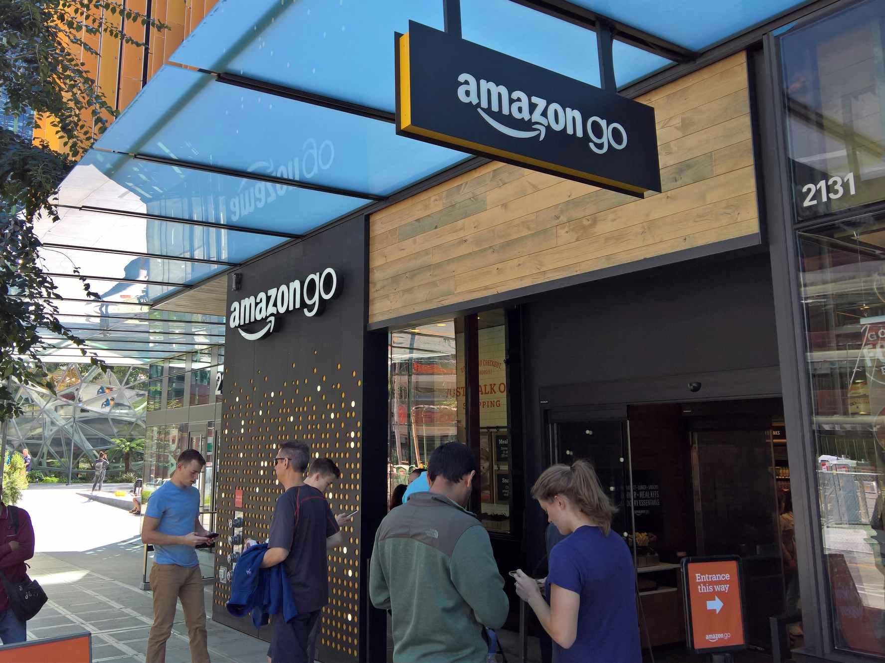 An Amazon Go store with people outside.