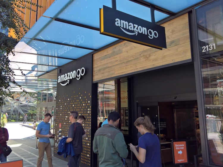An Amazon Go store with people outside.