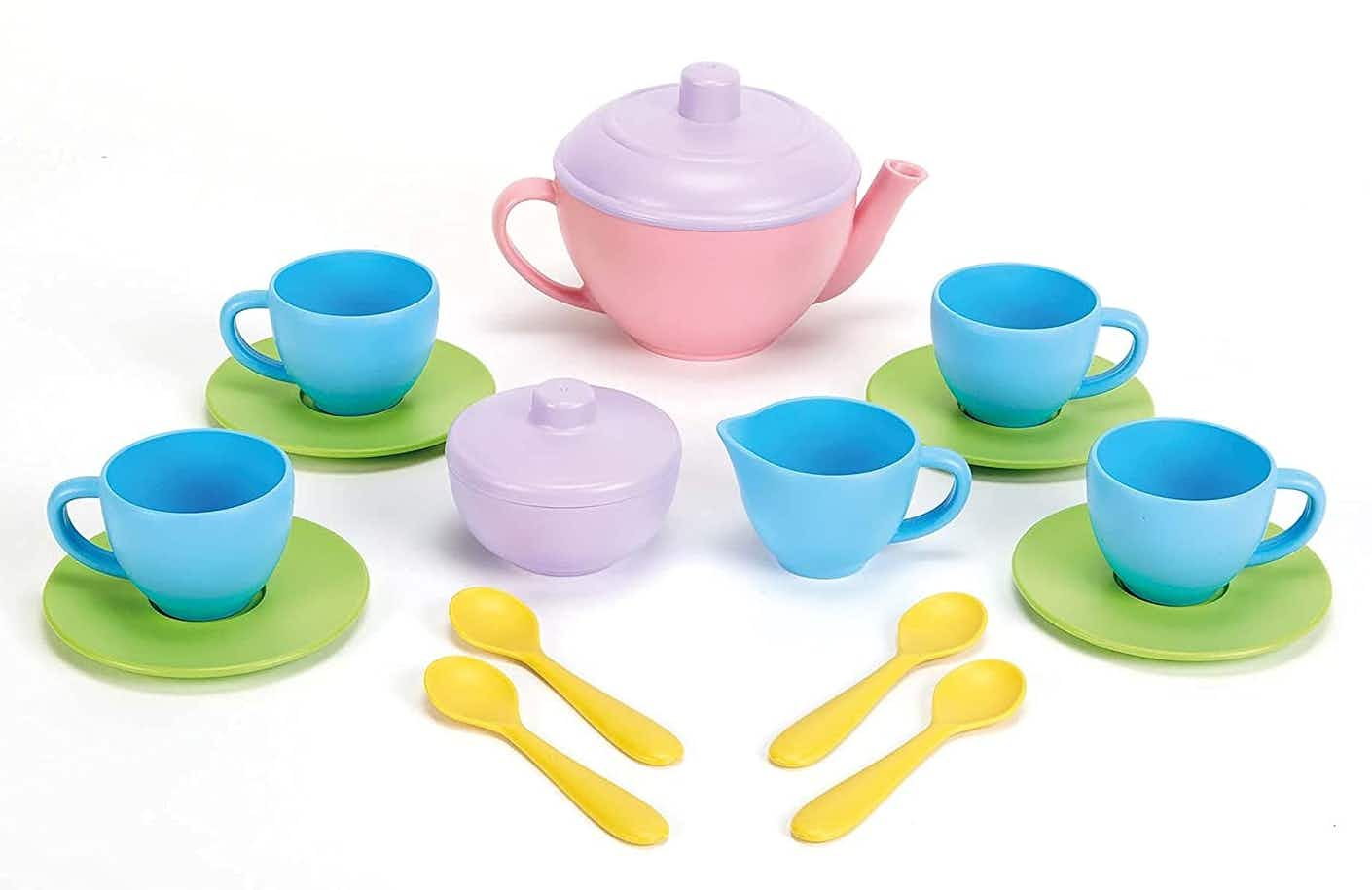 A set of Green Toys tea toys on a white background.