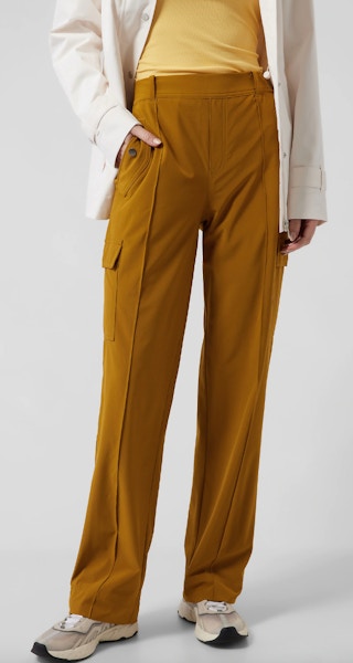 a woman wearing brown athleta pants