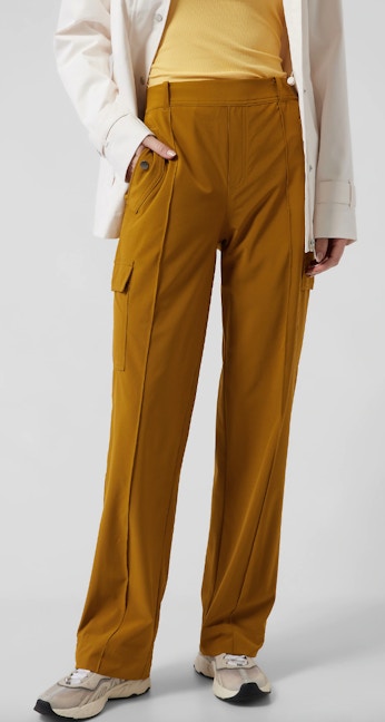 a woman wearing brown athleta pants