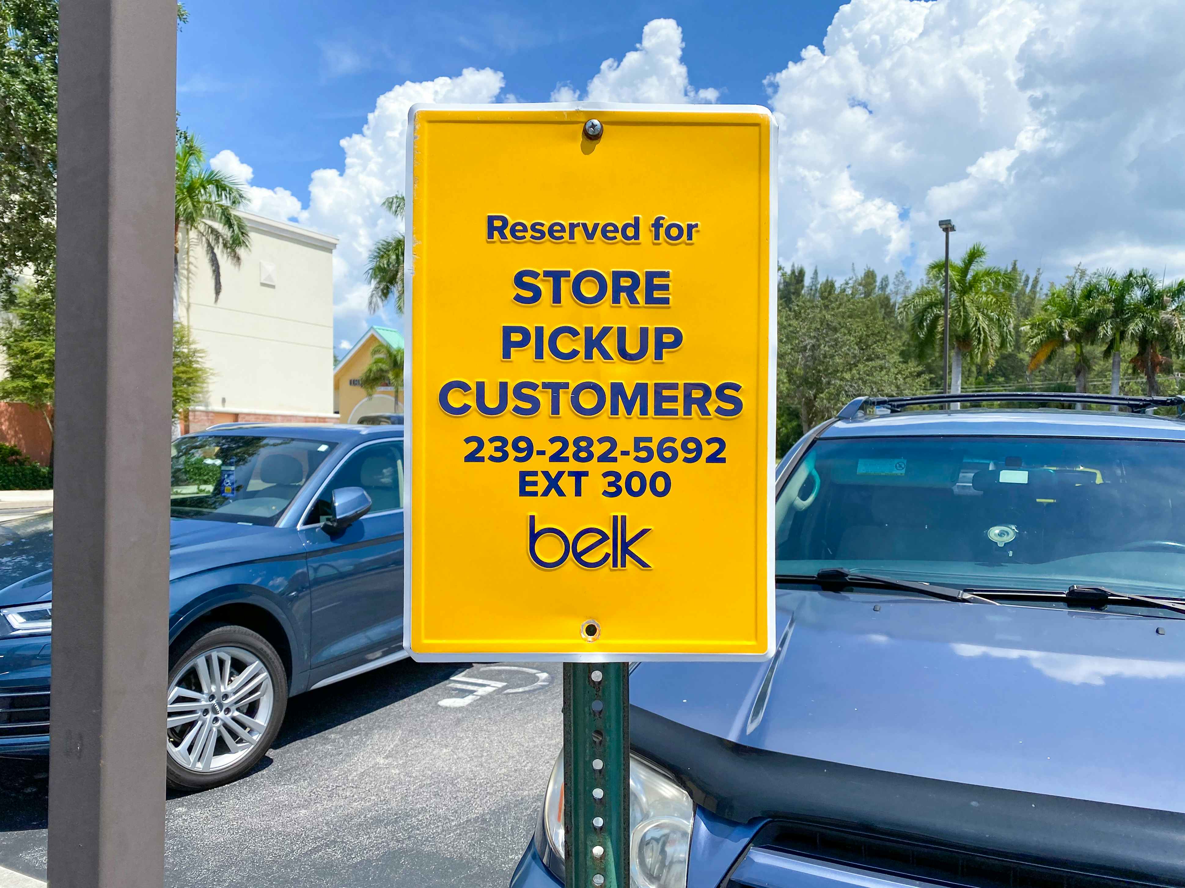 A sign in the Belk parking lot designating the spot for curbside pickup.