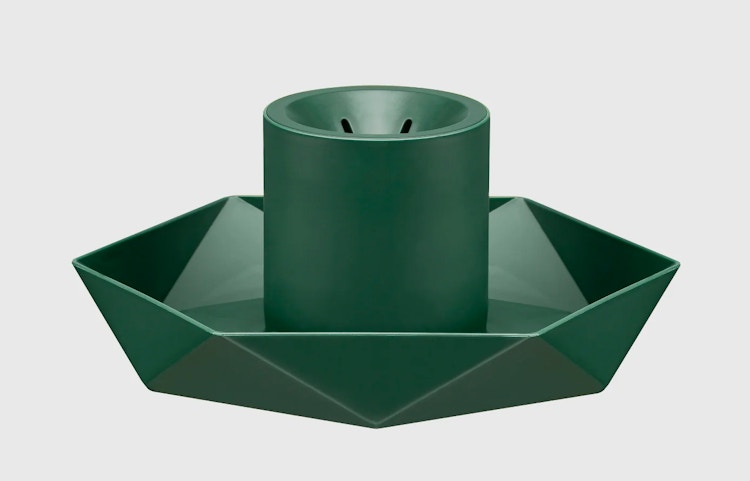 A Green diamond ArtificialChristmas tree stand on a grey background.