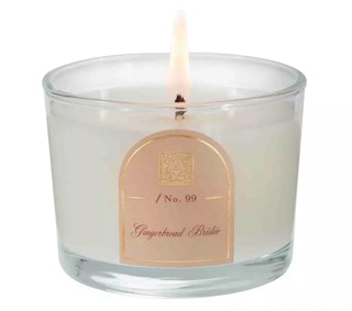 A Gingerbread Brulee candle from Macy's on a white background