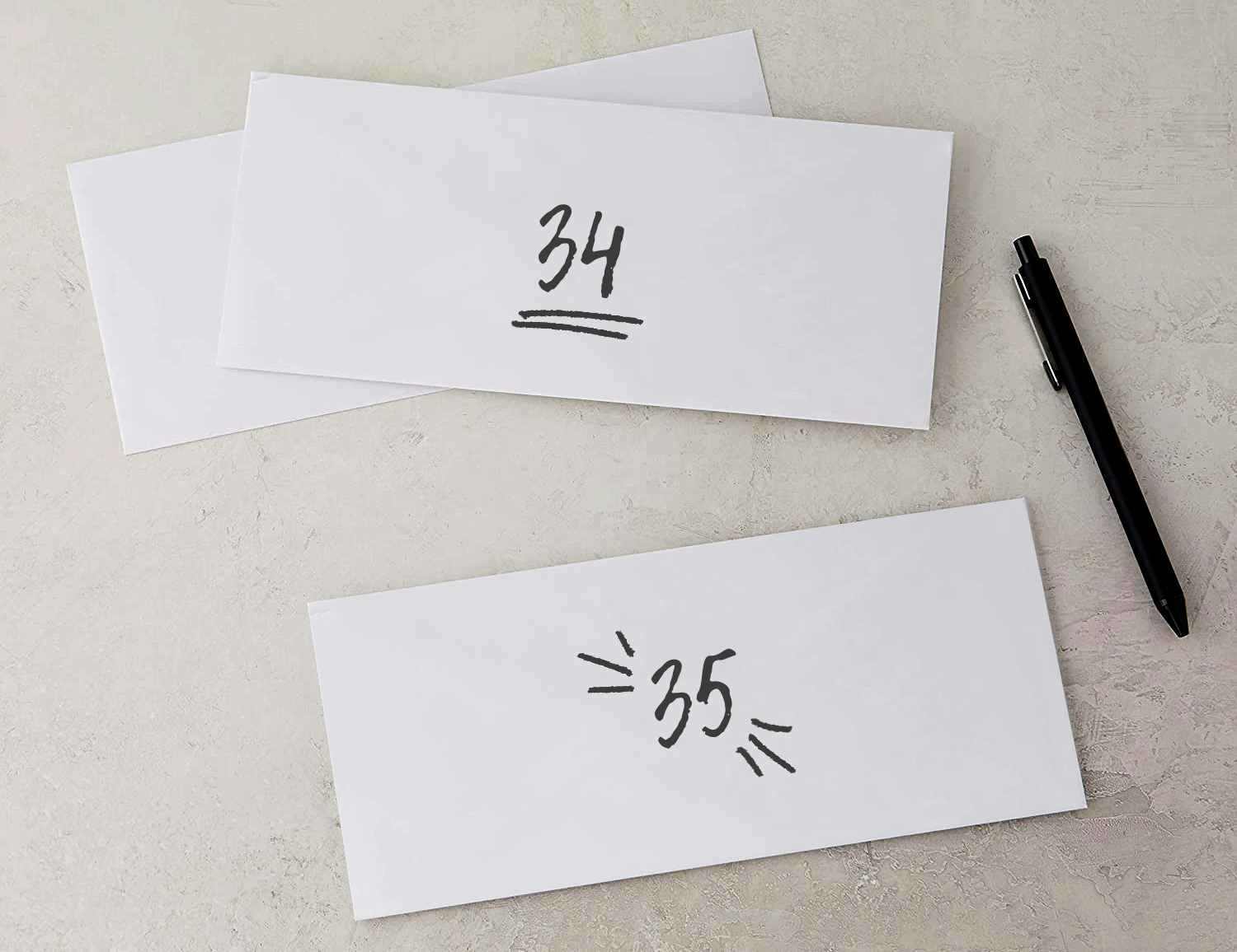 business envelopes with numbers written on them