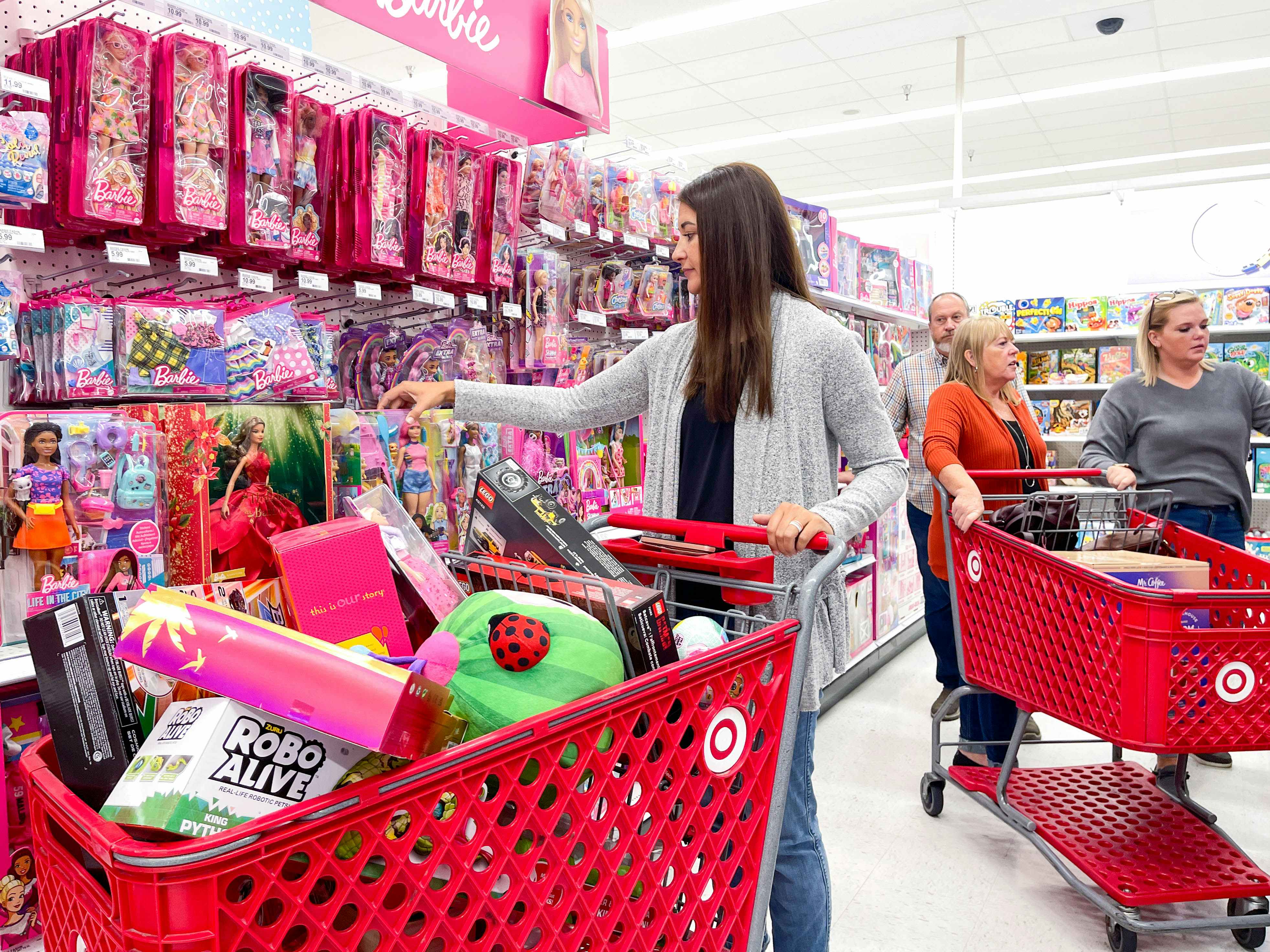 A person pushing a Target cart in the store during Black Friday.