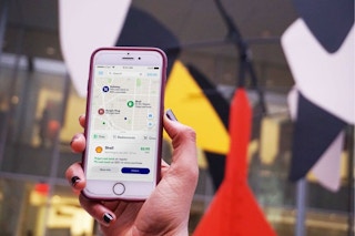 hand holding phone with upside cash-back app displayed