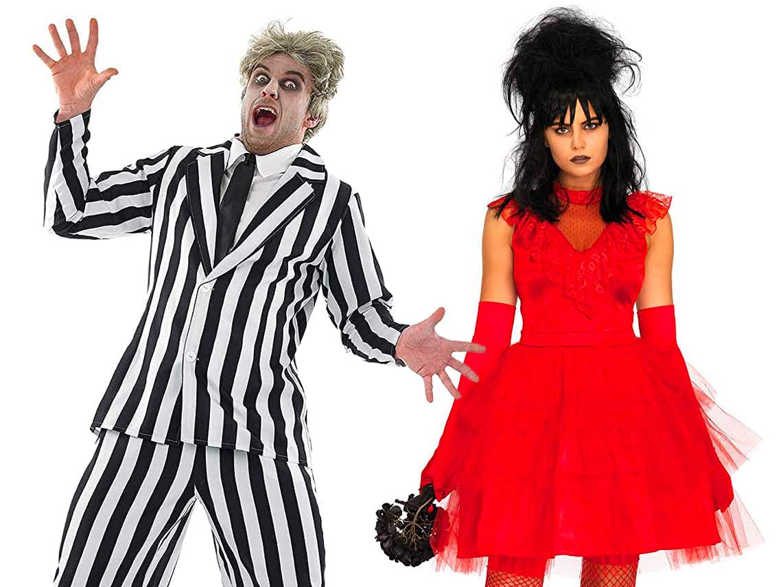 Two people dressed as Beetlejuice and Lydia Deetz on a white background.