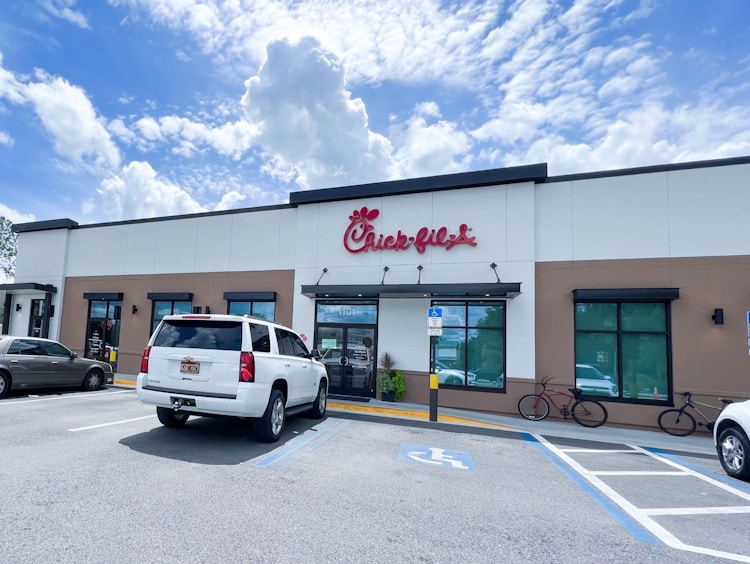 Cars parked outside of a Chick-fil-A restaurant