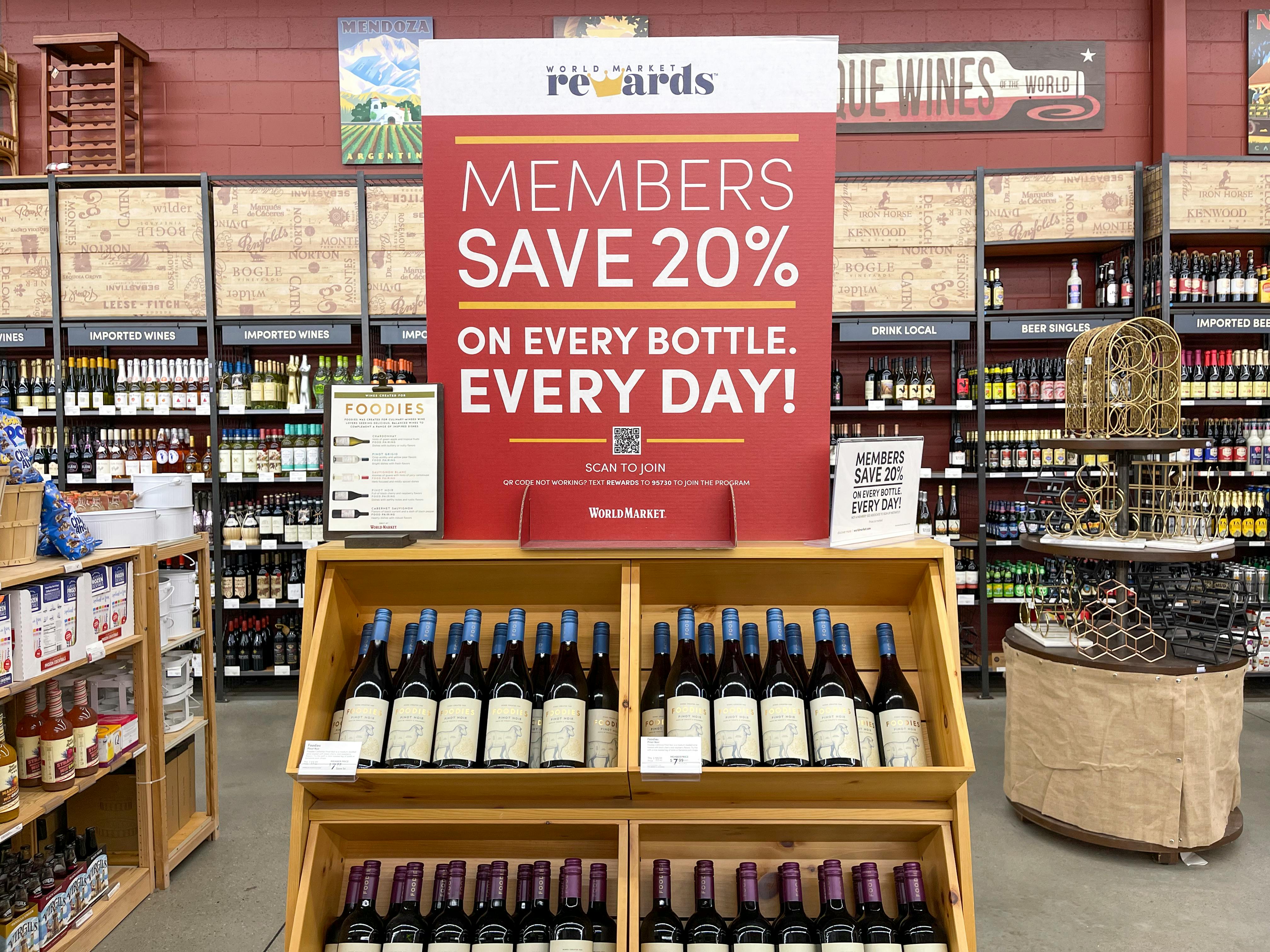 A sign for 20% off wine with the Cost Plus World Market rewards program membership.