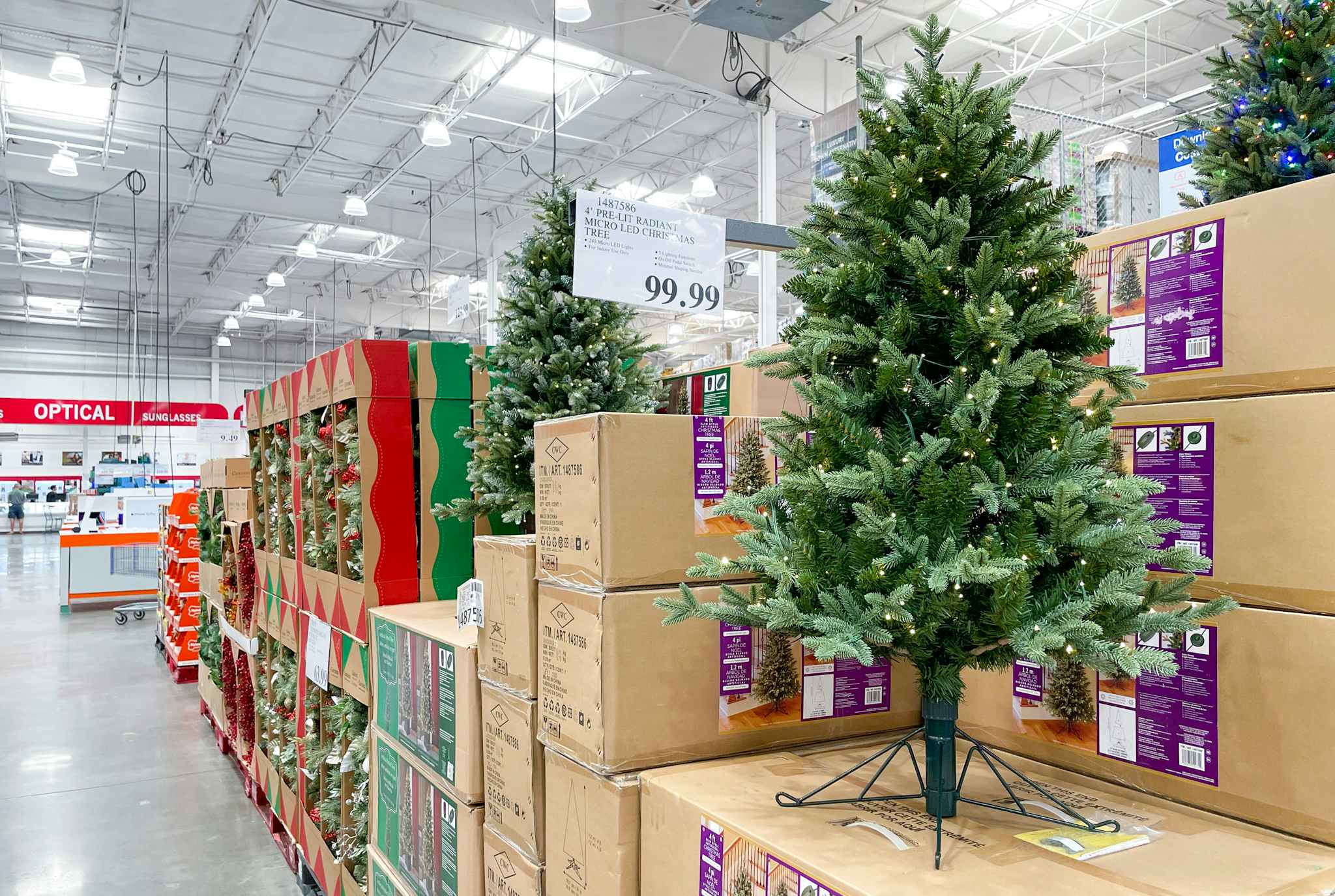 christmas tree on display at costco with sale sign