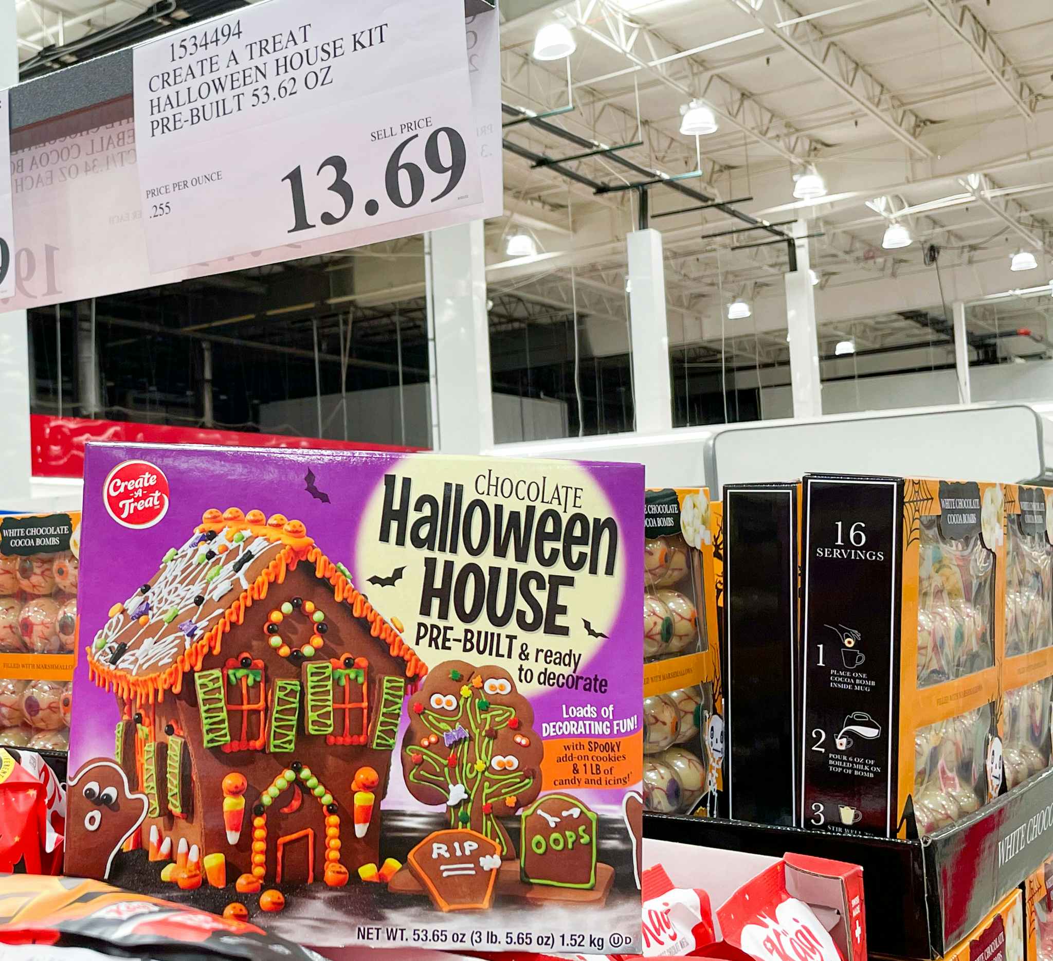 halloween chocolate house on display with sale sign at costco