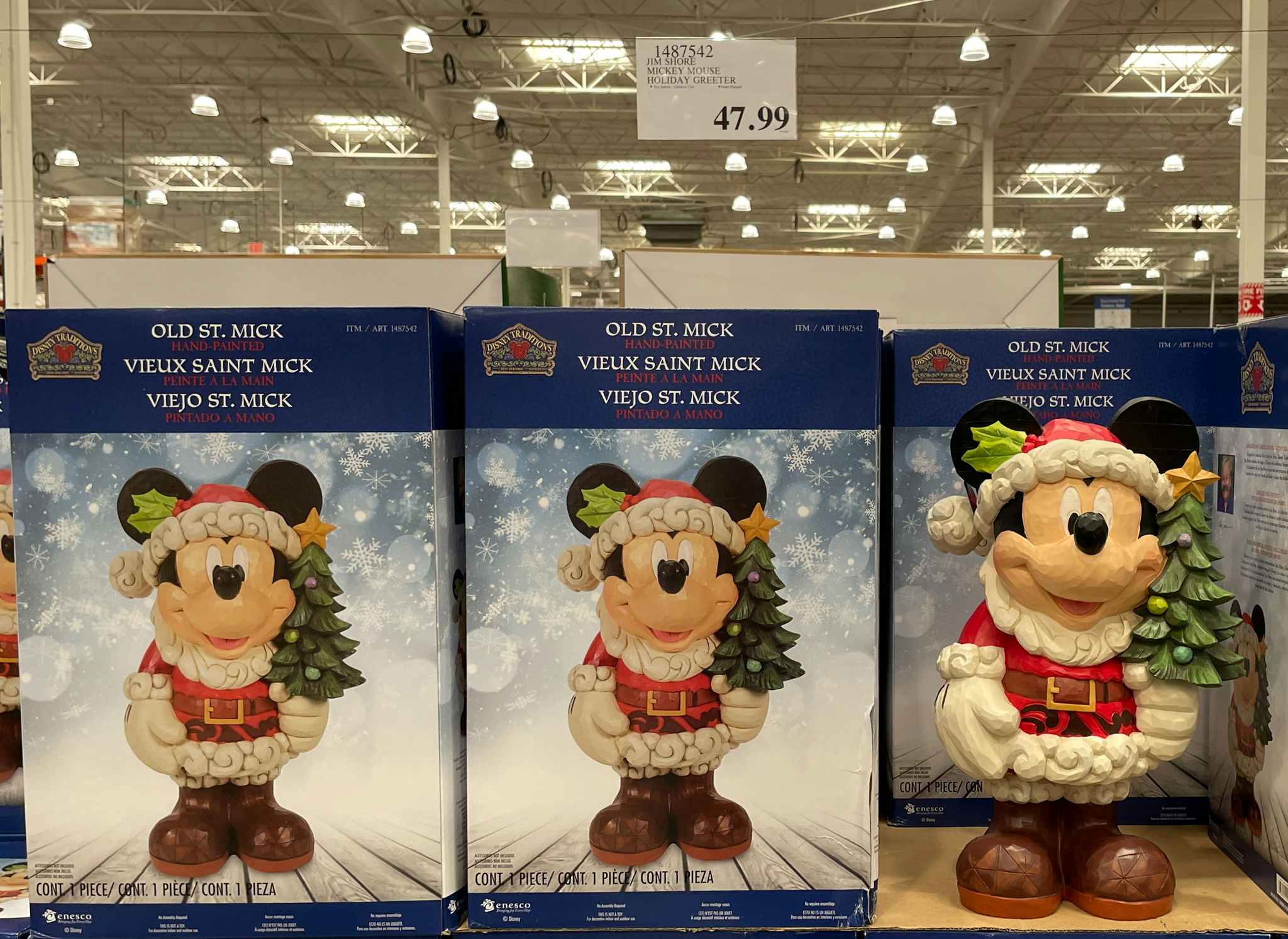 mickey mouse holiday greeter on display with sale sign at costco