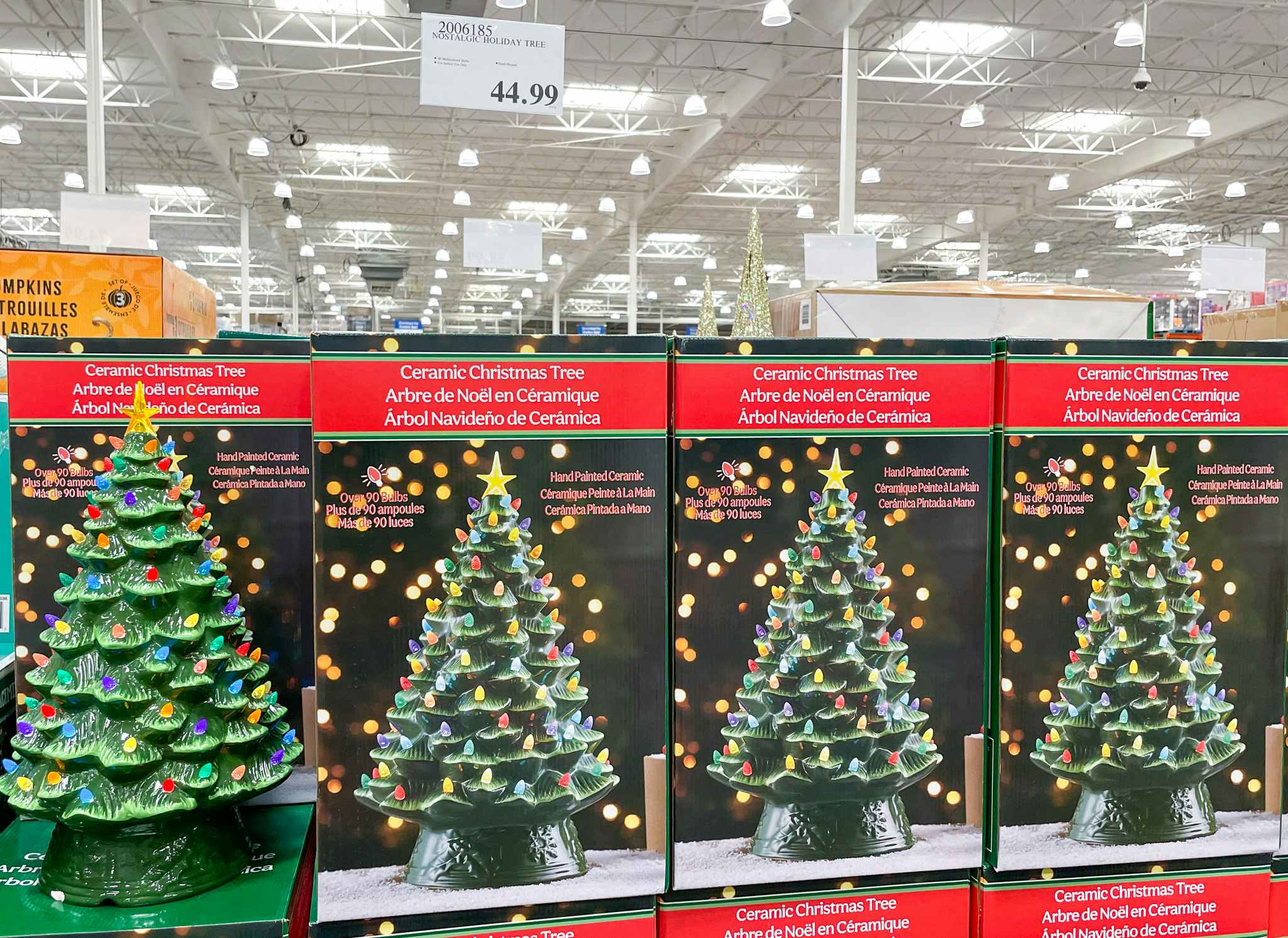 ceramic Christmas tree on display with sale sign at costco
