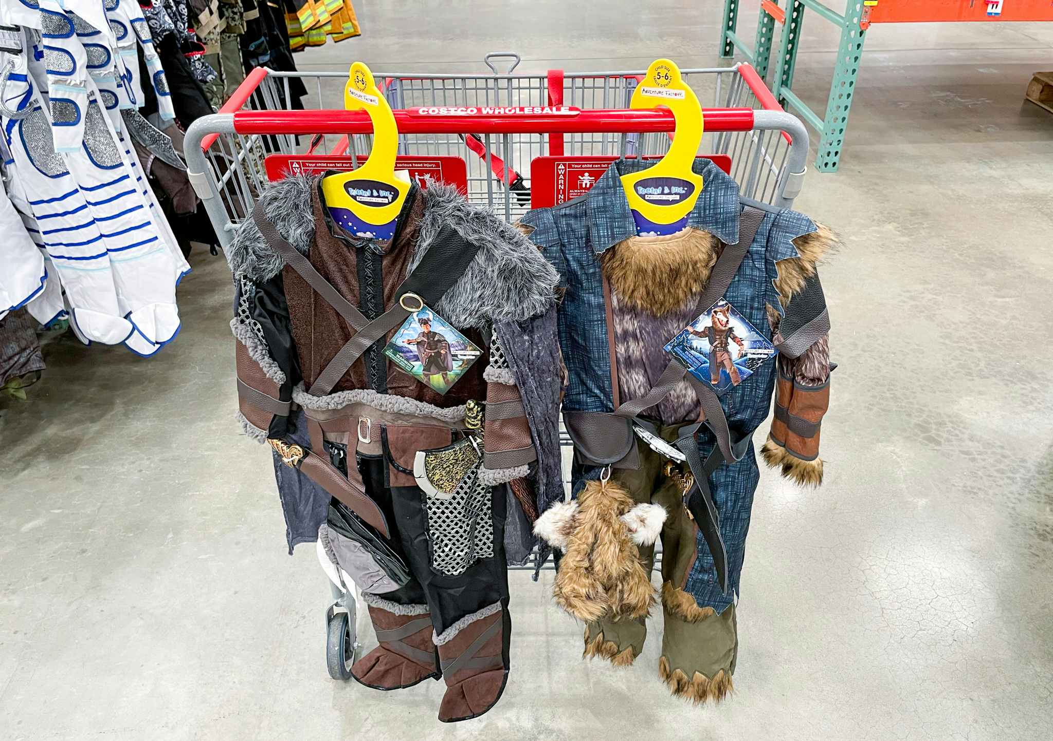 halloween costumes on a cart at costco viking and werewolf 