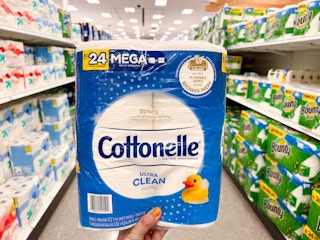 hand holding cottonelle toilet paper at target