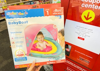 hand holding baby boat next to coupon center