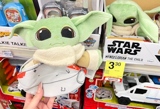 grogu push held next to clearance tag