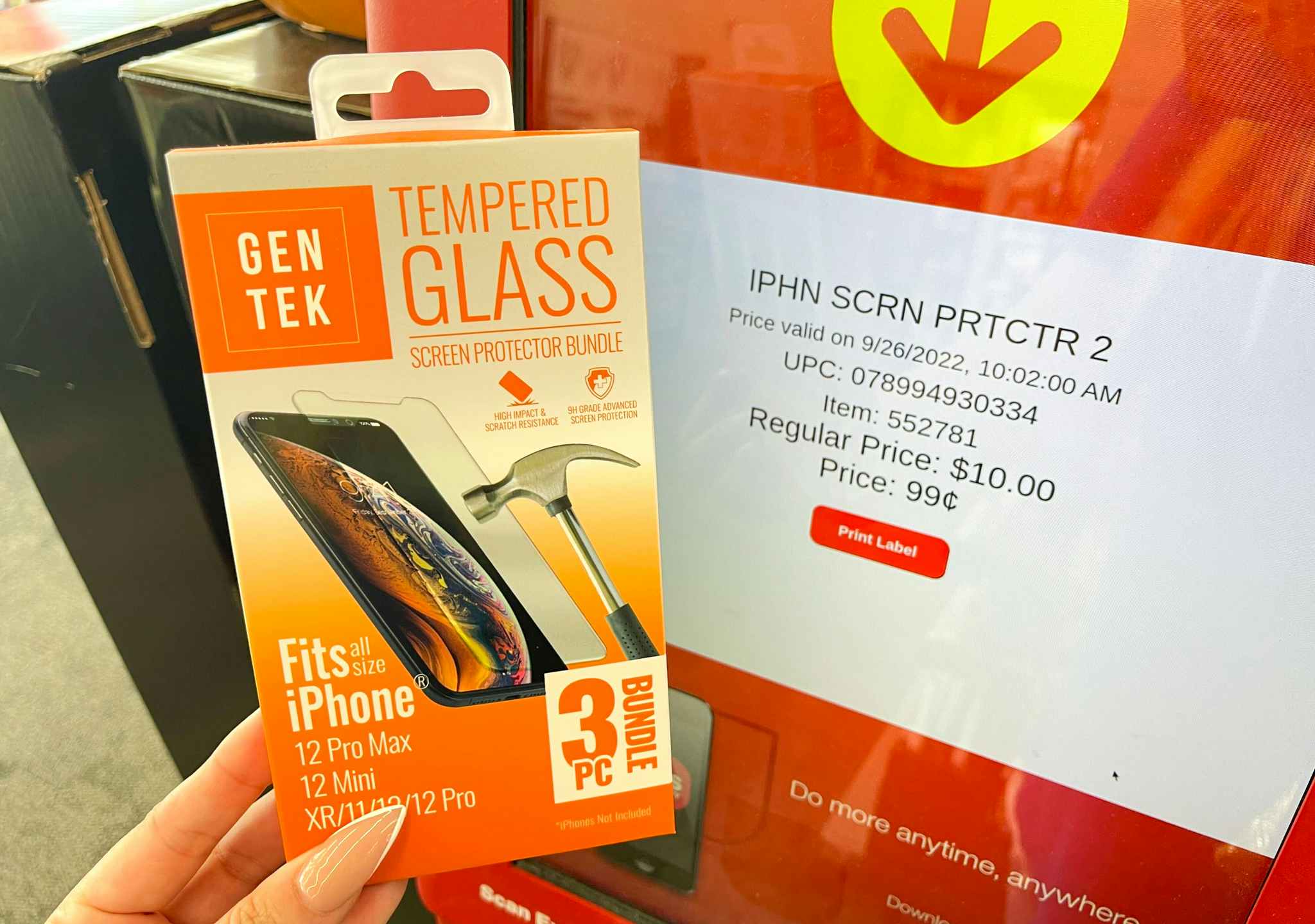 hand holding screen protector next to coupon center