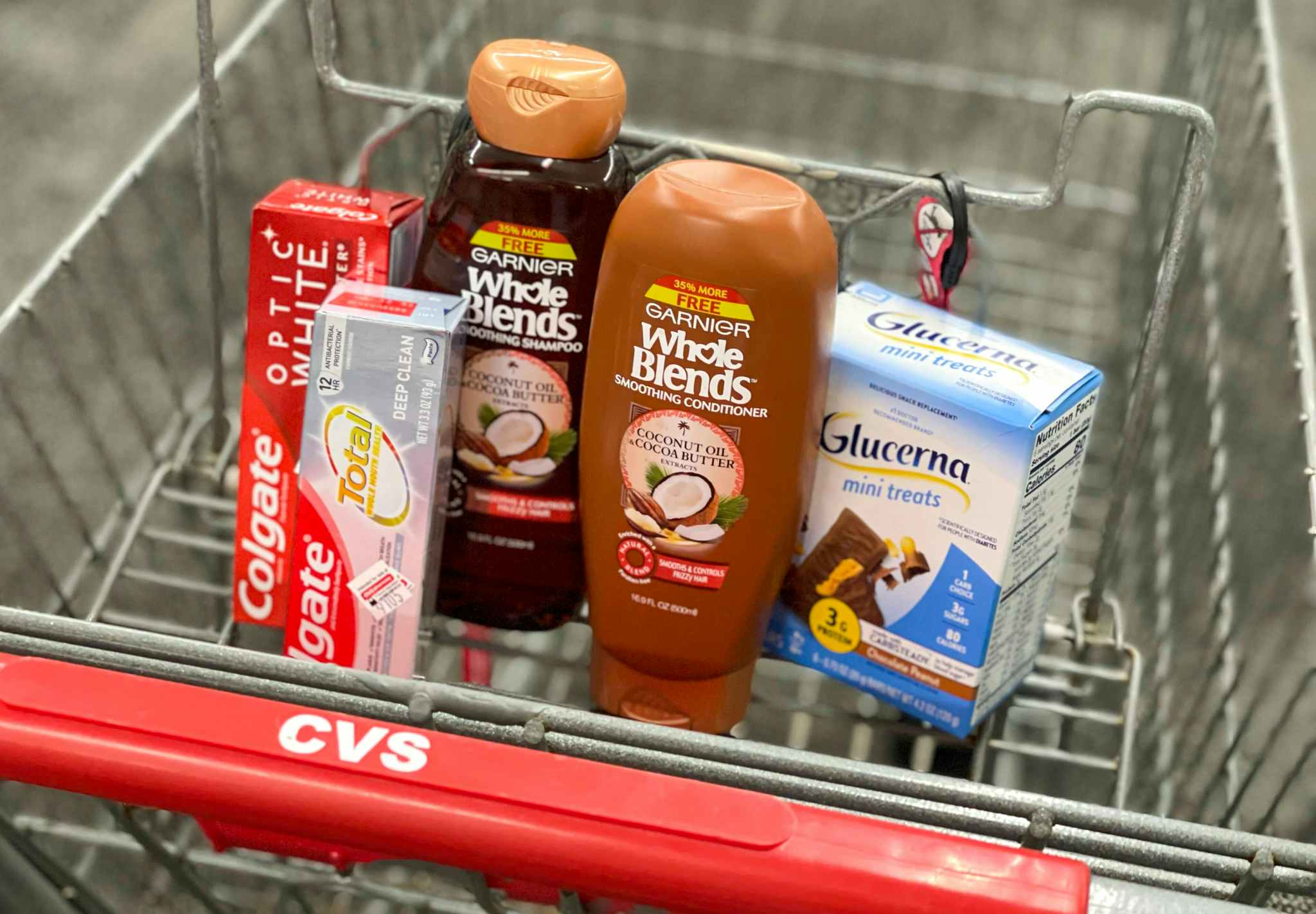 cvs shopping cart with colgate, garnier, and glucerna