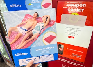 hand holding wave float next to coupon center