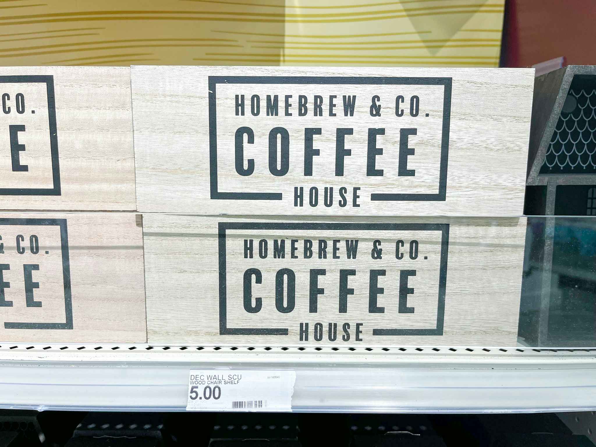 coffee house sign on the shelf in the dollar spot at target