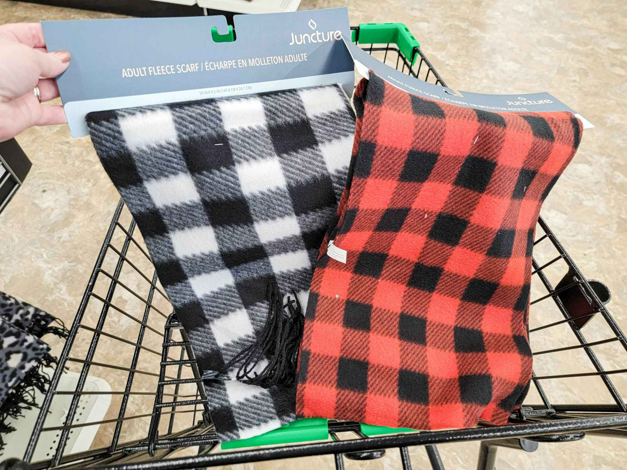 white & black buffalo plaid scarf with a red & black buffalo plaid scarf in a cart