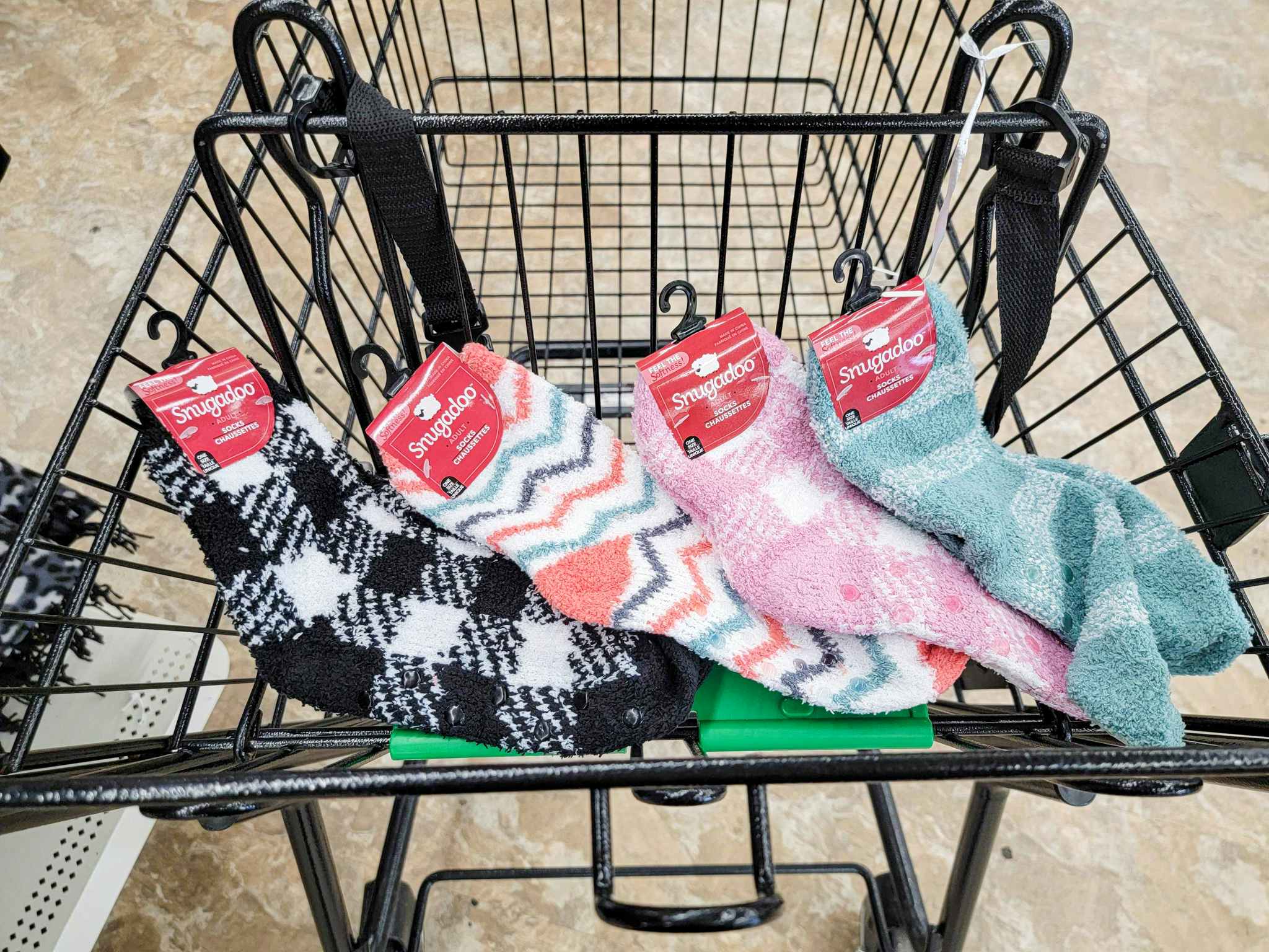 four pairs of adult fuzzy socks in a cart