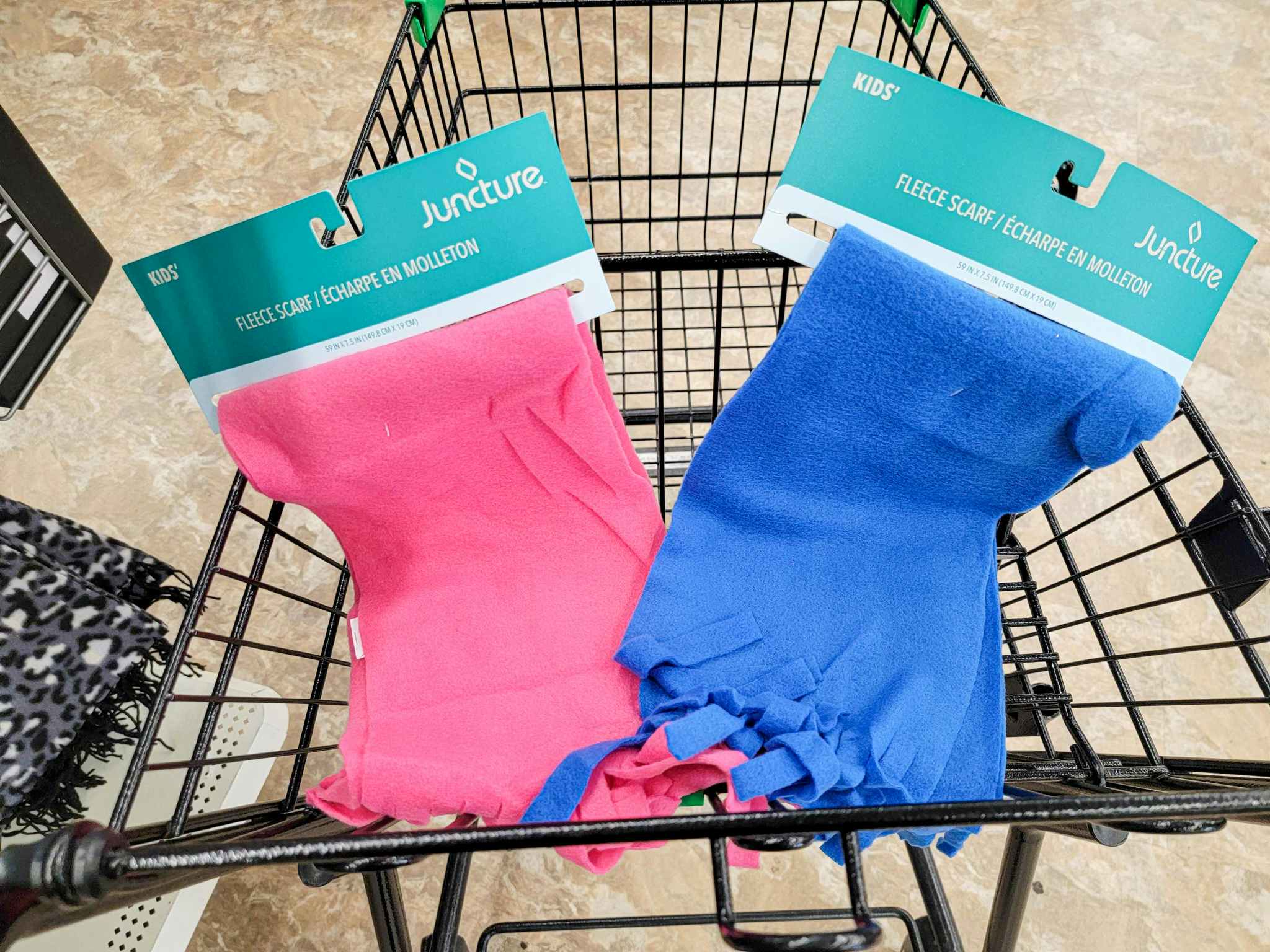 pink and blue fleece scarves in a cart