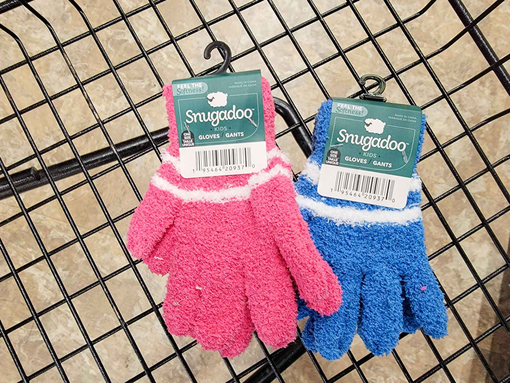 2 pairs of kids fuzzy gloves in a cart