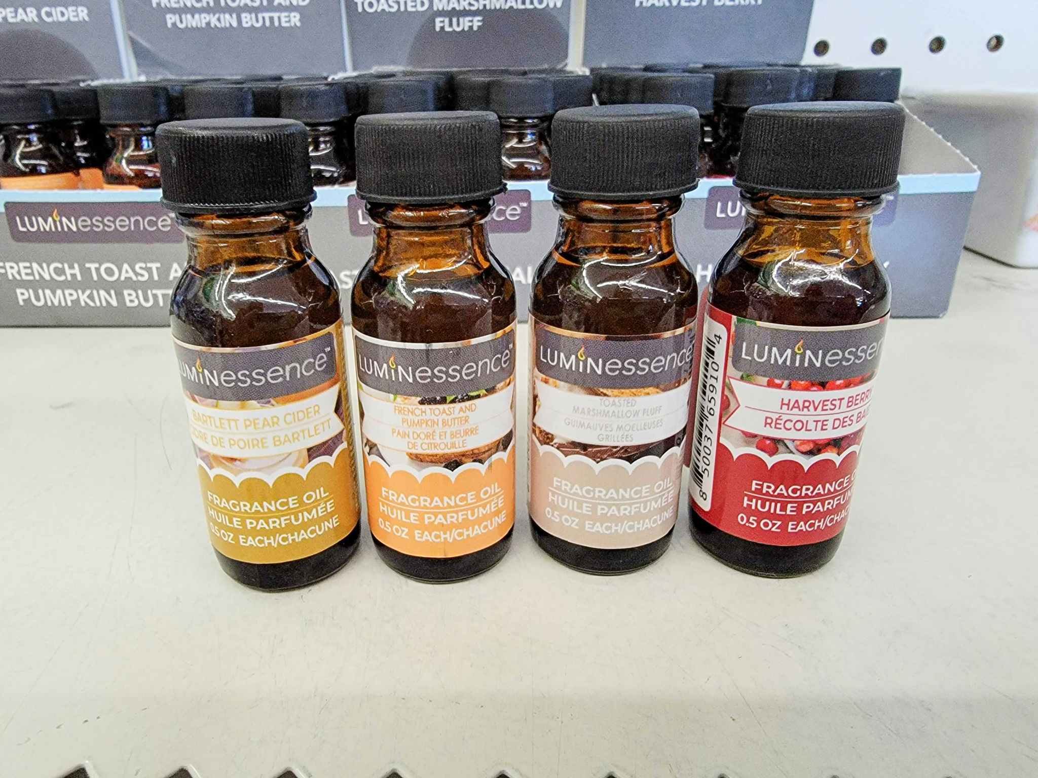 four fall scented fragrance oils on a shelf