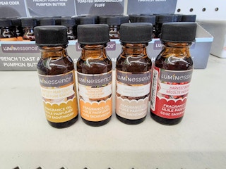 four fall scented fragrance oils on a shelf