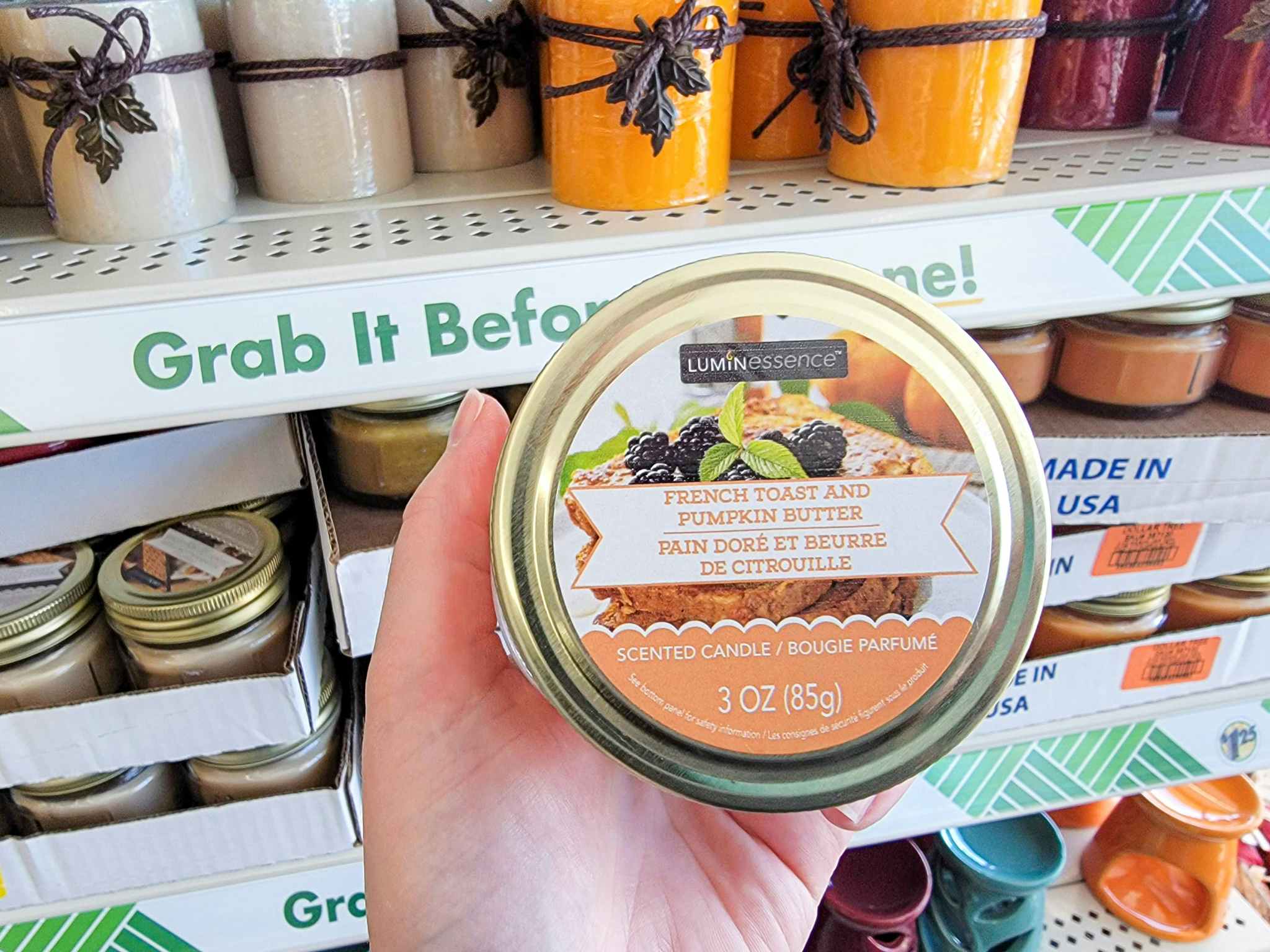 hand holding a french toast pumpkin butter scented candle