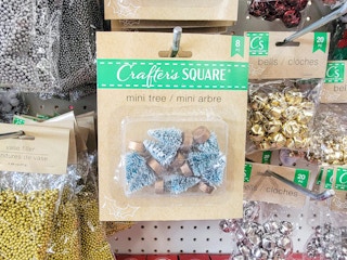 mini green snow covered christmas trees