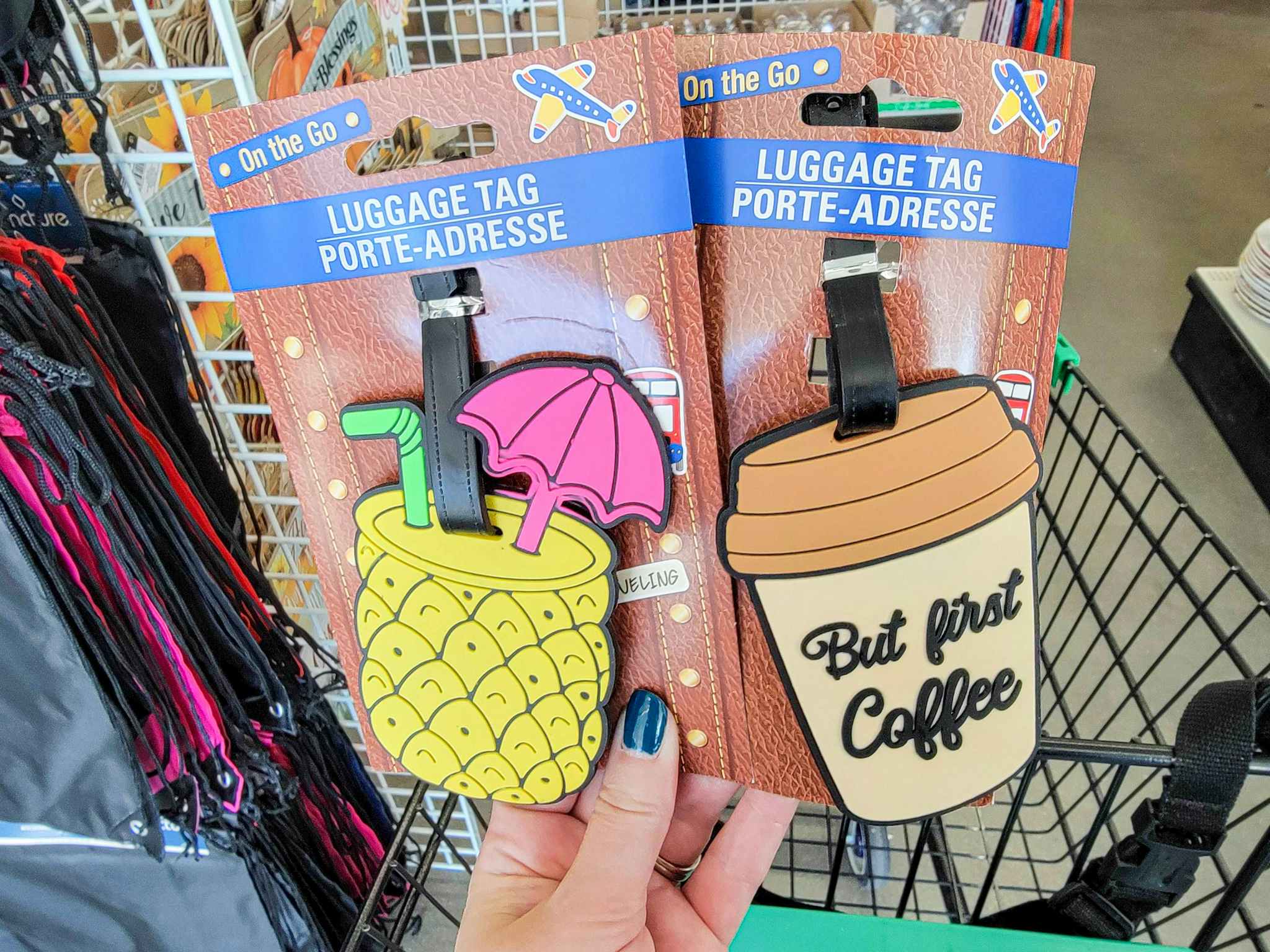 hand holding a pineapple and but first coffee luggage tags