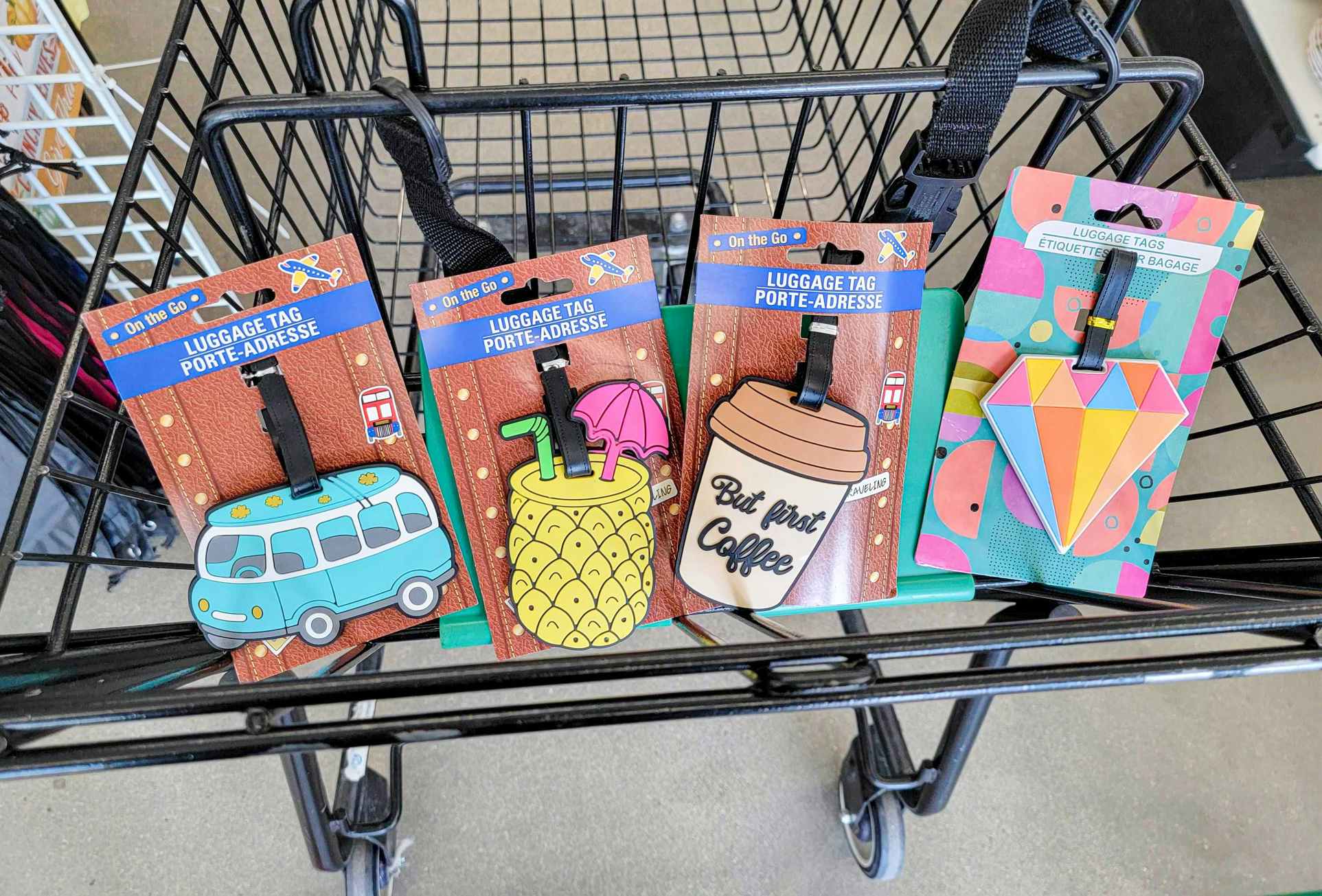 4 novelty luggage tags in a cart